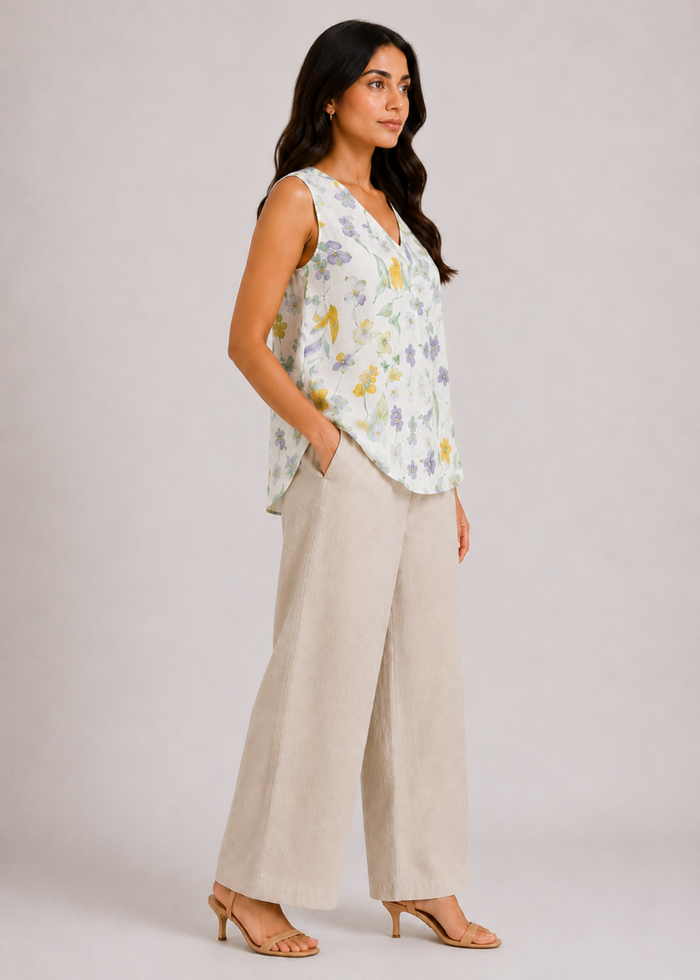 Flurr linen ivory floral top showing the relaxed silhouette and floral print from the left side