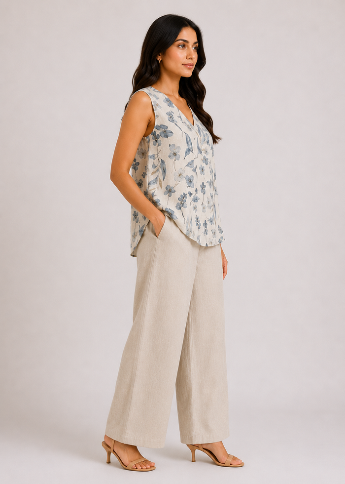 Flurr Linen Blossom floral top for women, right side view showing the relaxed fit and curved hem