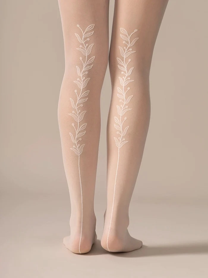Back view of the legs in the Back Vine Sheer Tights in Creamy White, showing the vine pattern running up the back leg.