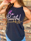 Amanda Bright Designs female model wearing a dark gray tank top with the text 'BE BEAUTIFUL' and a signature tagline printed in sunset colors.