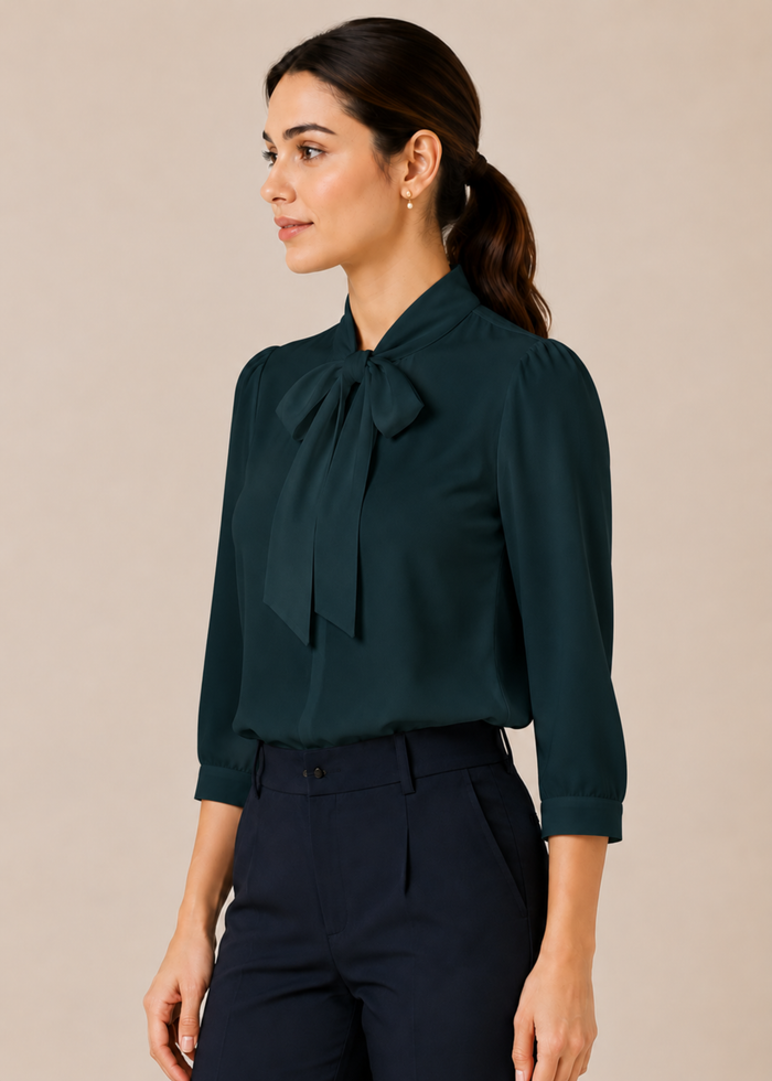 Flurr teal blue bow tie neck top, left side view