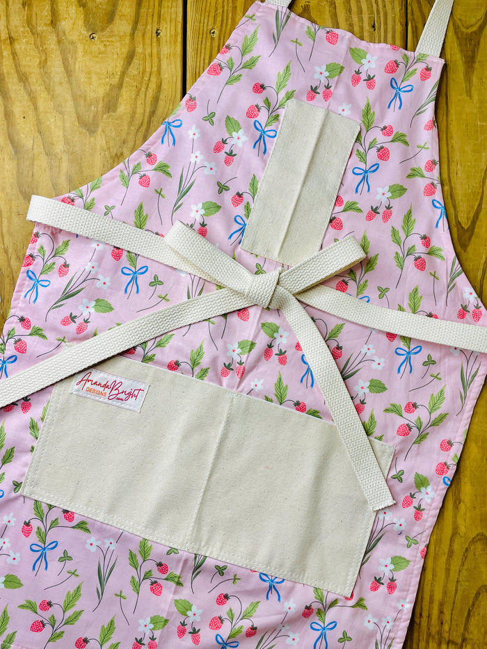 Amanda Bright Designs pink apron with strawberries blue bows white flowers