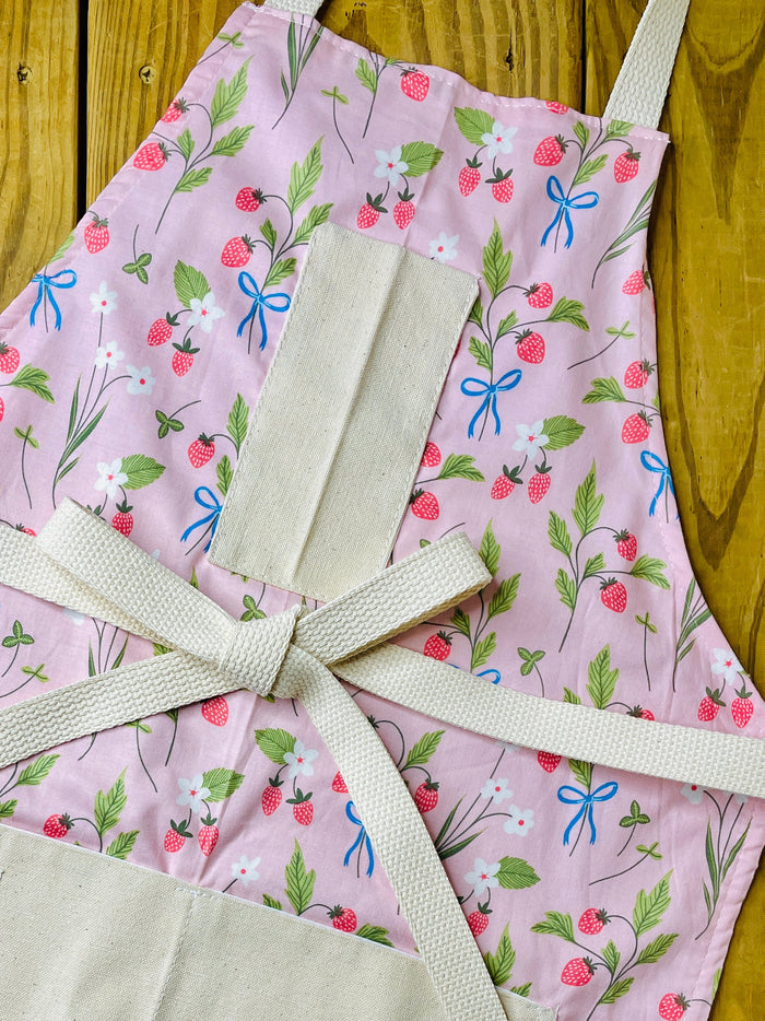 Amanda Bright Designs pink floral apron with strawberries blue bows white flowers