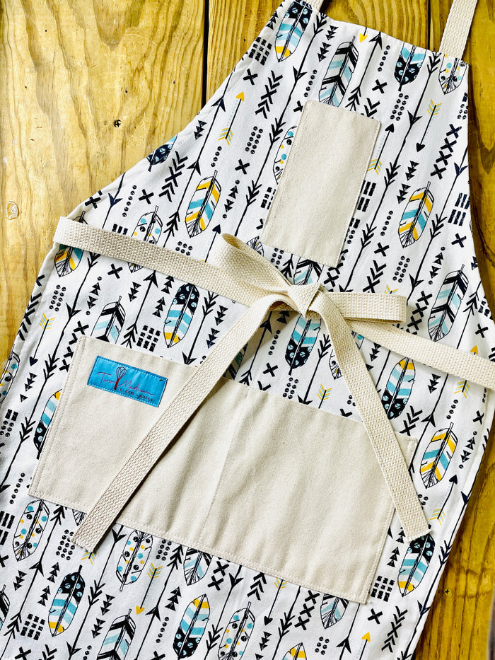 Candace arrow and feather kitchen baking cooking gardening apron feathers and arrows navy blue and gold turqoisue new mexico southwest style amanda bright designs