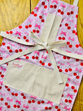 Amanda Bright Designs Pink Bows and Cherries Apron with pink hearts