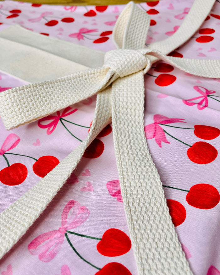 Amanda Bright Designs Pink Bows and Cherries Apron with pink hearts