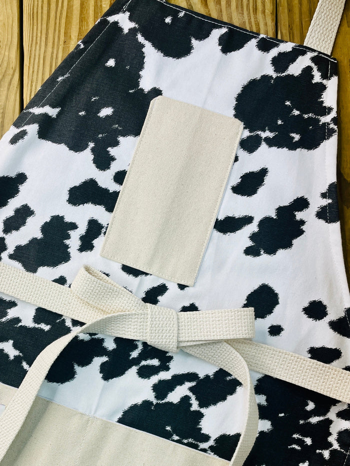 Amanda Bright Designs cheyenne horse lover western black and white cowhide print apron with webbed cotton strings and canvas pockets