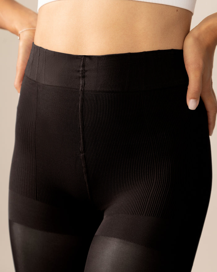 Close-up front view of the Contour Shaping Panty on the Classic Over-the-Knee Tights in Black, showing the high-waisted, opaque-to-sheer construction.