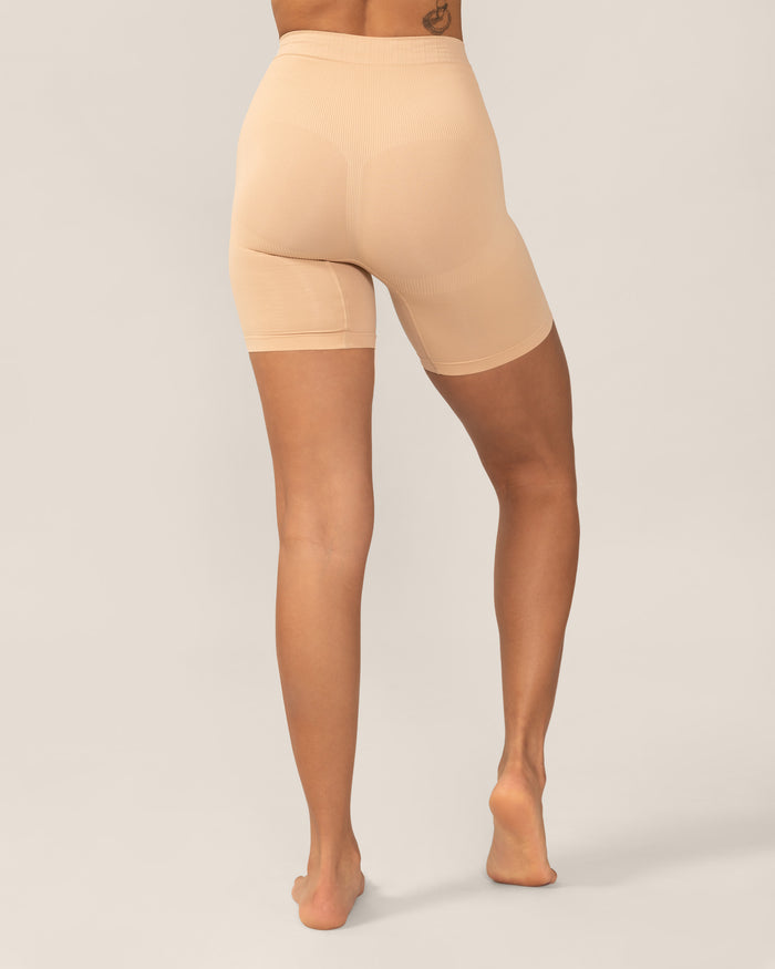 Beige shapewear shorts worn by a person