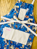 Blue apron with cowgirl pattern Amanda bright designs rattlesnake horse head, Rose cowboy boots western