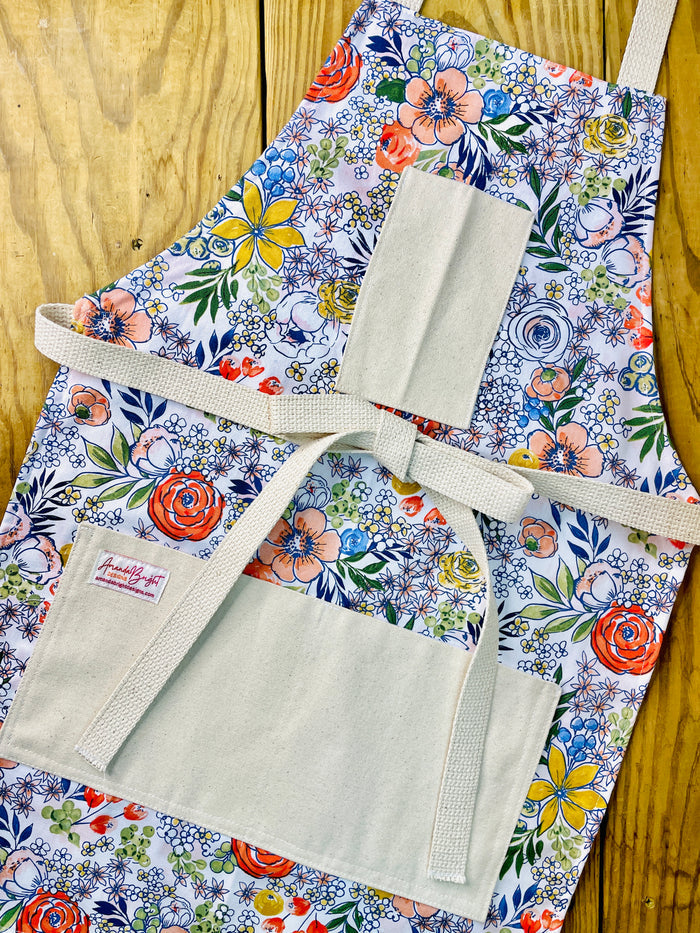 Amanda Bright Designs brightly colored floral patterned apron with pockets and strings