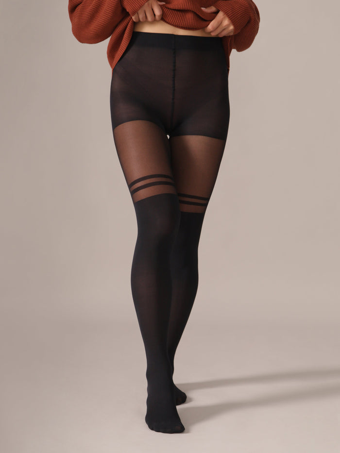 Person wearing from Rachel black double stripe tights on a studio background