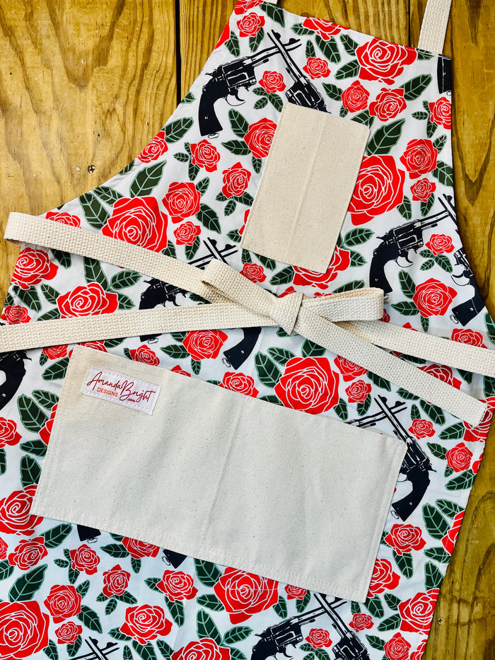 Amanda Bright Designs Floral apron with red roses and revolver guns