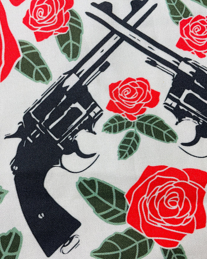 Amanda Bright Designs Floral apron with red roses and revolver guns
