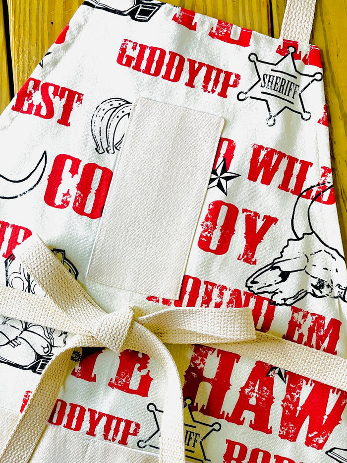 Cowboy Apron Jane Long Mother of Texas boots, steer, sheriff badge, stars, horseshoes, roping cowboy, horse