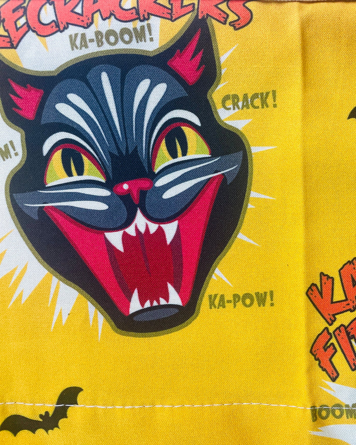 Amanda Bright Designs Ka-Boom Black Cat Fireworks Yellow and Black Bats Halloween themed Apron