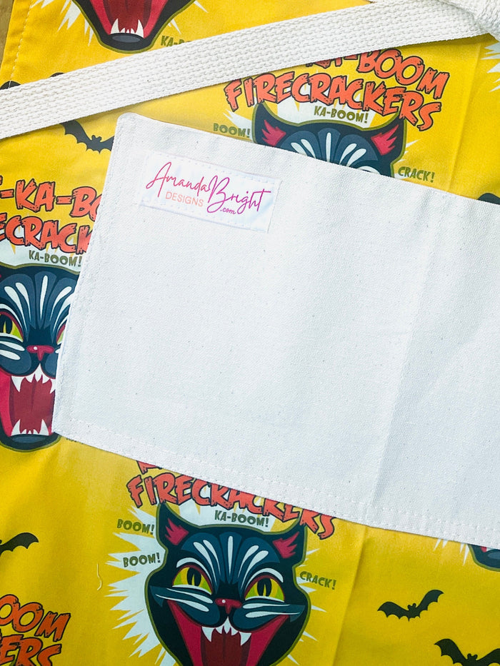 Amanda Bright Designs Ka-Boom Black Cat Fireworks Yellow and Black Bats Halloween Apron