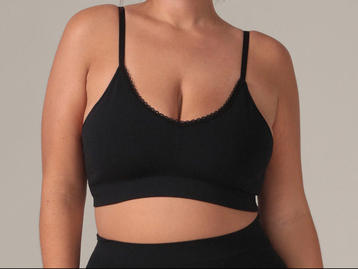 Woman wearing a black bralette