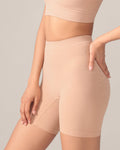 Beige shapewear shorts being worn