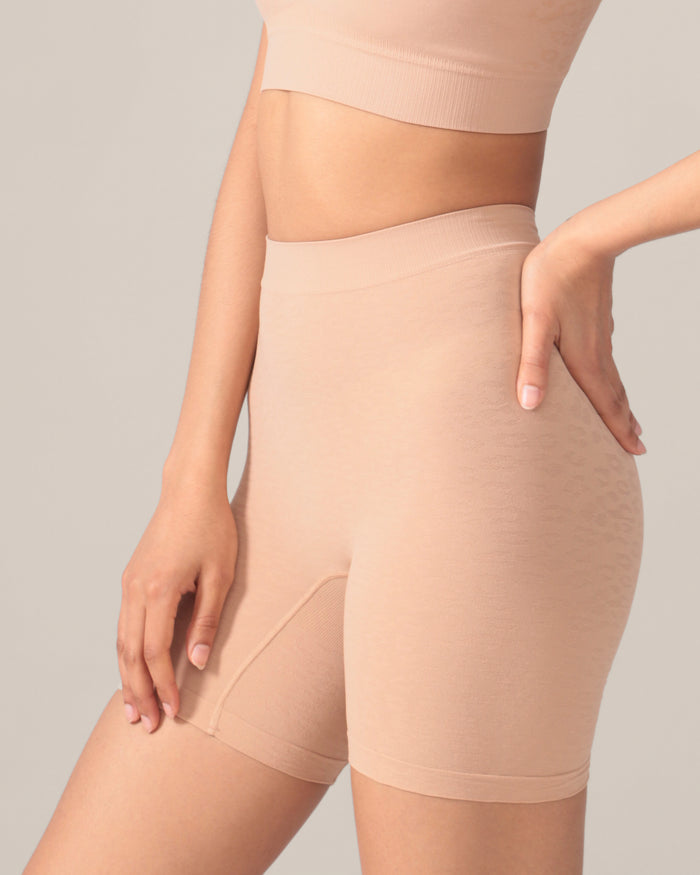 Beige shapewear shorts being worn