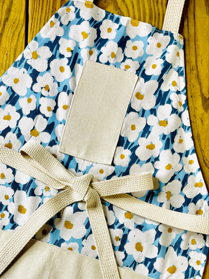Blue and white floral cotton apron with yellow centers amanda bright desigs
