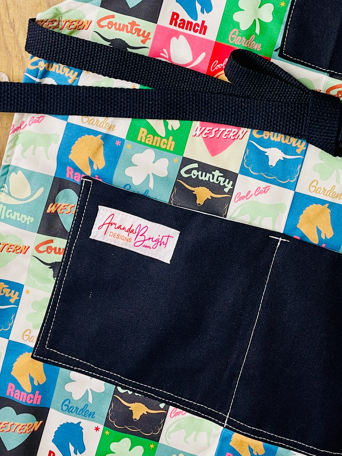 Amanda Bright Designs lucky u closeup of lower apron pockets black canvas cotton checkerboard pattern apron squares ranch western country horse chess piece steer garden
