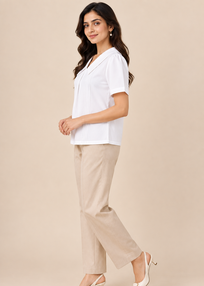 Flurr Maison Collar Top in white showing left side fit and pintuck detailing