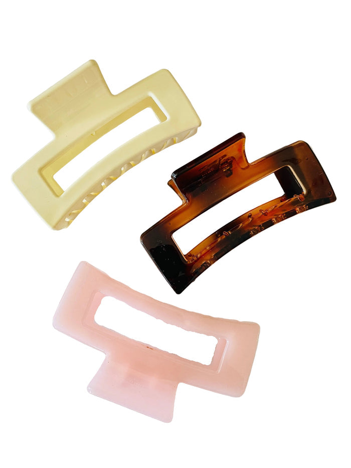 Amanda Bright Designs Three rectangular hair claw in beige, tortoiseshell, and pink on a white background