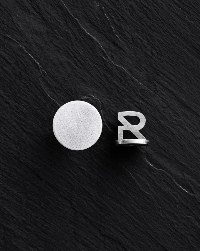 Silver single earring PUNKT