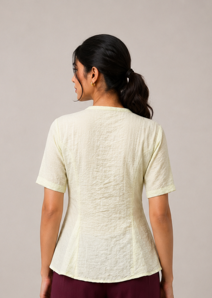 Flurr soft peplum button-down top back view, showing the full silhouette