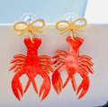 Amanda Bright Designs crawfish acrylic earrings with gold bow
