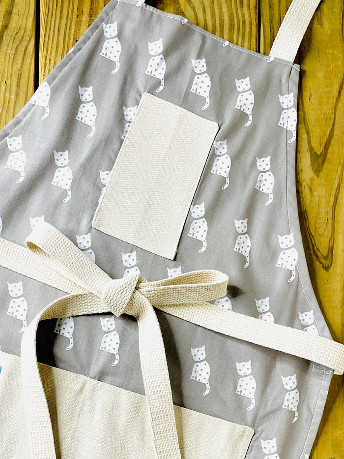 Tammi white cat on gray fabric apron cat lovers