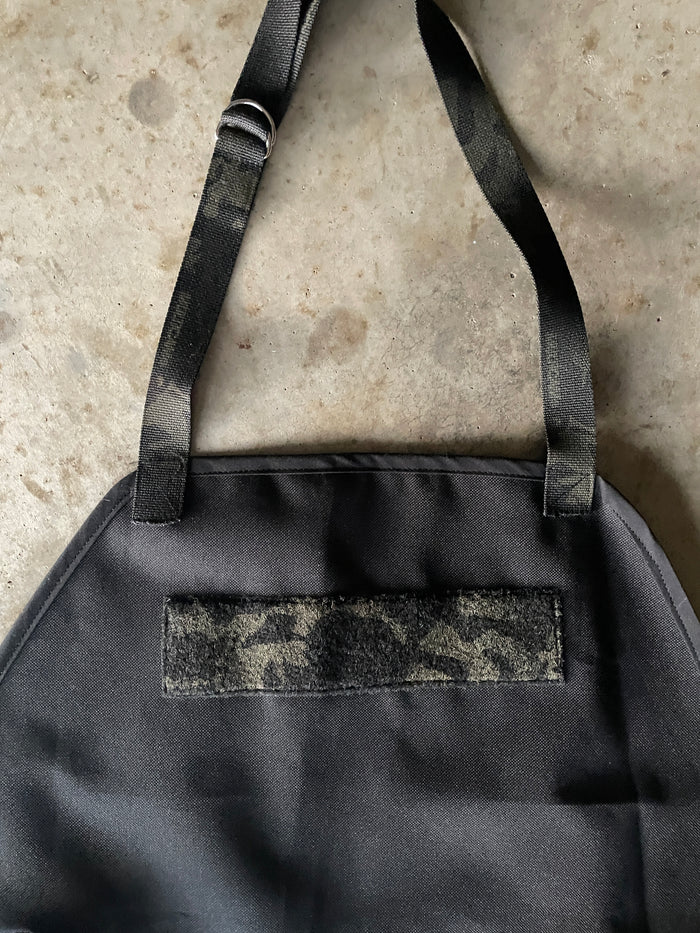 Amanda Bright designs black waterproof canvas apron the dutch Schwarzenegger patch area