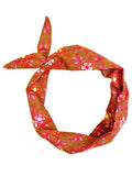 Amanda Bright Designs knotted cotton headband with a retro floral pattern in orange, pink, cinnamon and white