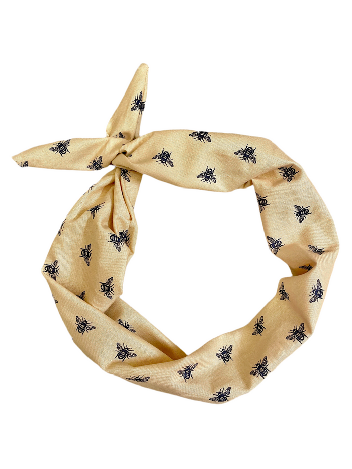 Amanda Bright Designs stylized navy blue honey bees on a khaki colored 100% cotton headband