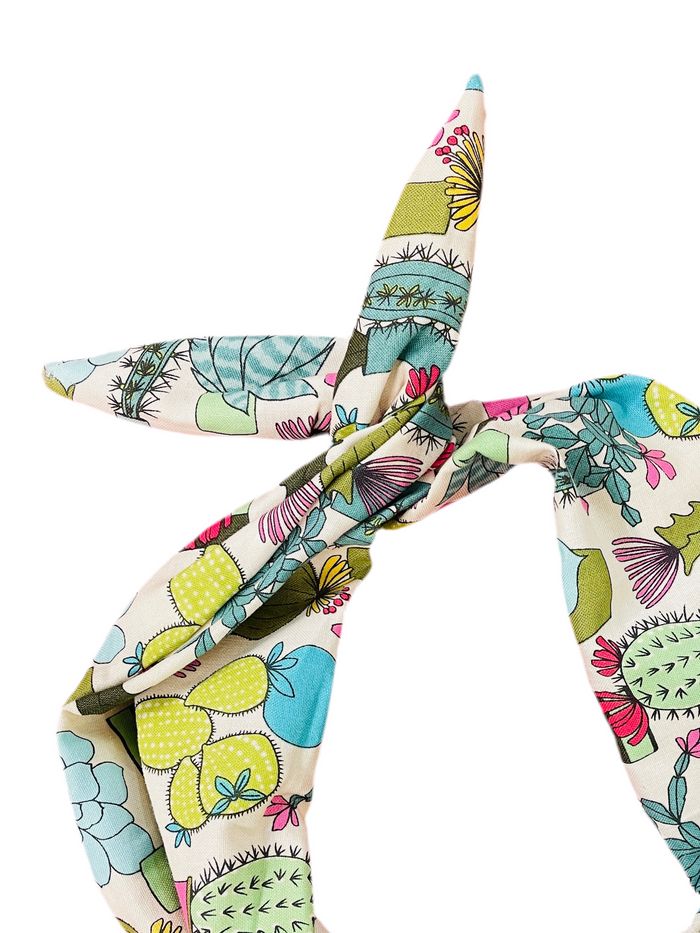 Amanda Bright Designs colorful cactus and succulent pattern on a cream background heaband