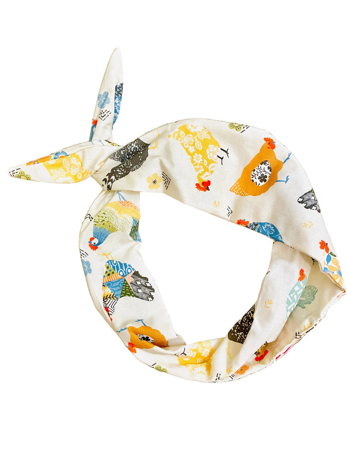 moldable bendable farmhouse pattern headband featuring a colorful pattern of stylized chickens on a cream background