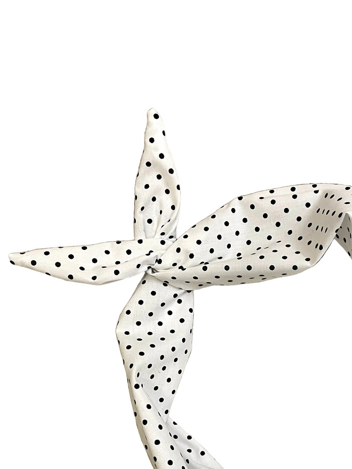 Amanda Bright Designs white cotton headband with a black polka dot pattern, styled in a knot