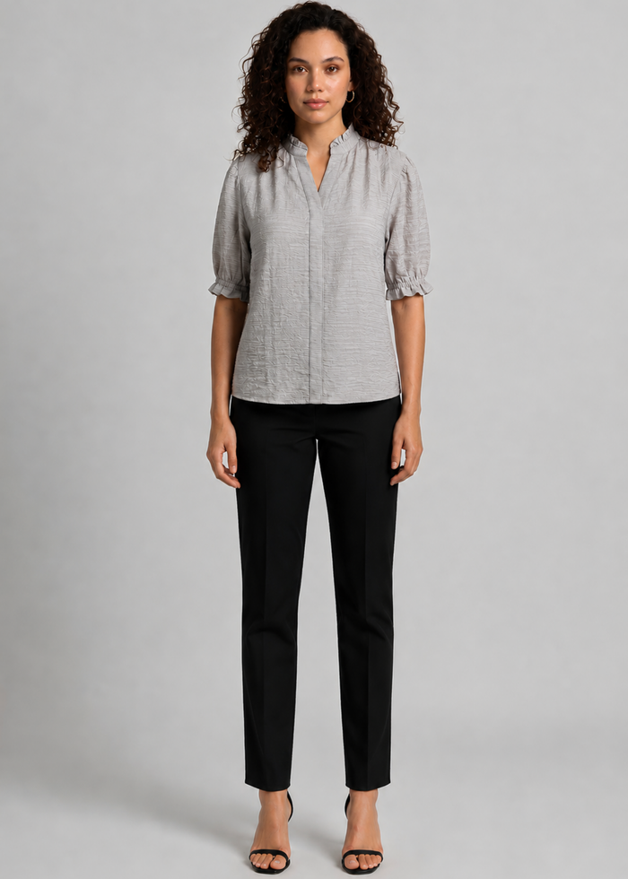 Flurr women’s textured ruffle-collar top in full front view, showcasing the elegant neckline and relaxed fit for professional officewear and modern workwear looks.