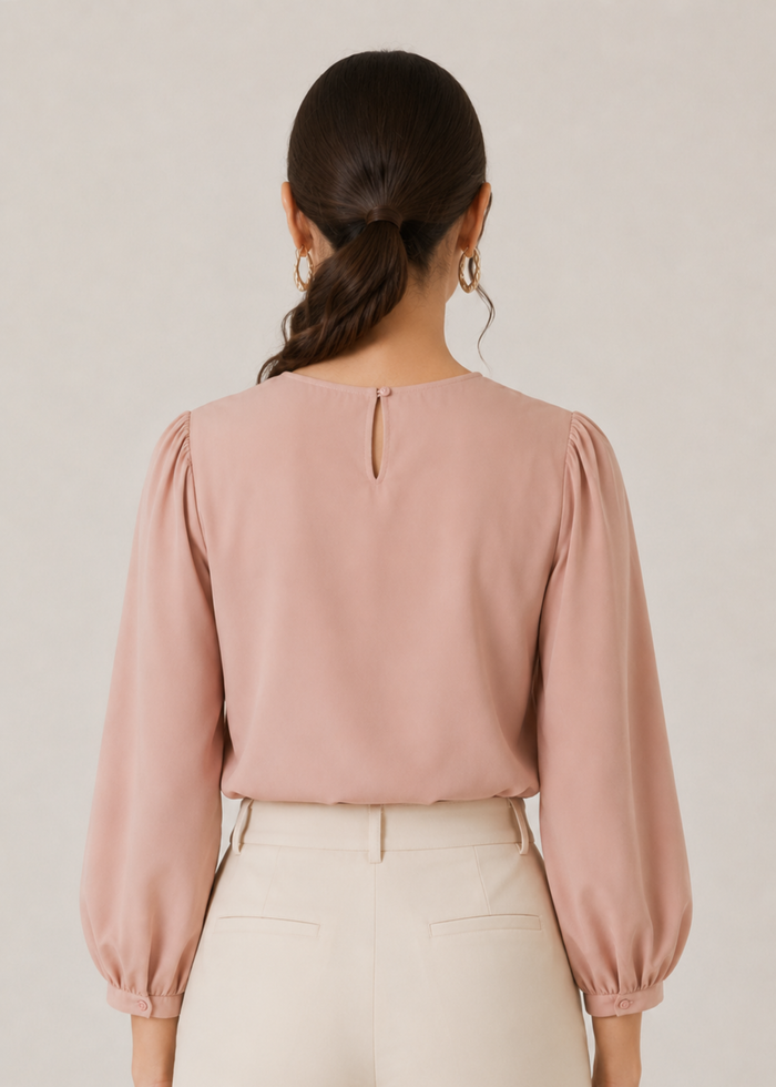 Flurr pink Office Crush Top showing the back silhouette and three-quarter puff sleeves
